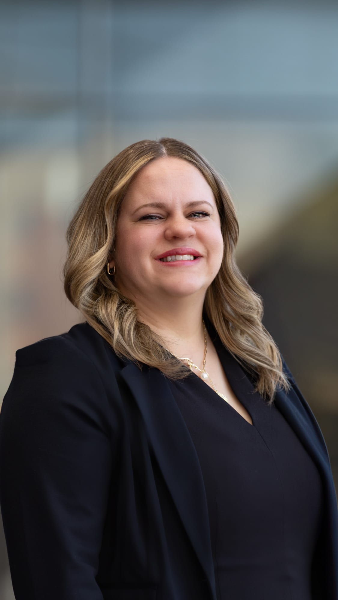 Business Woman Smiles Proudly for Portrait After Earning Degree From GCU