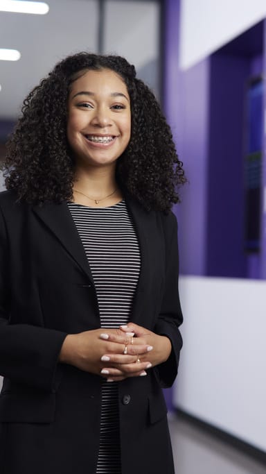 GCU Business Student Smiles for Portrait