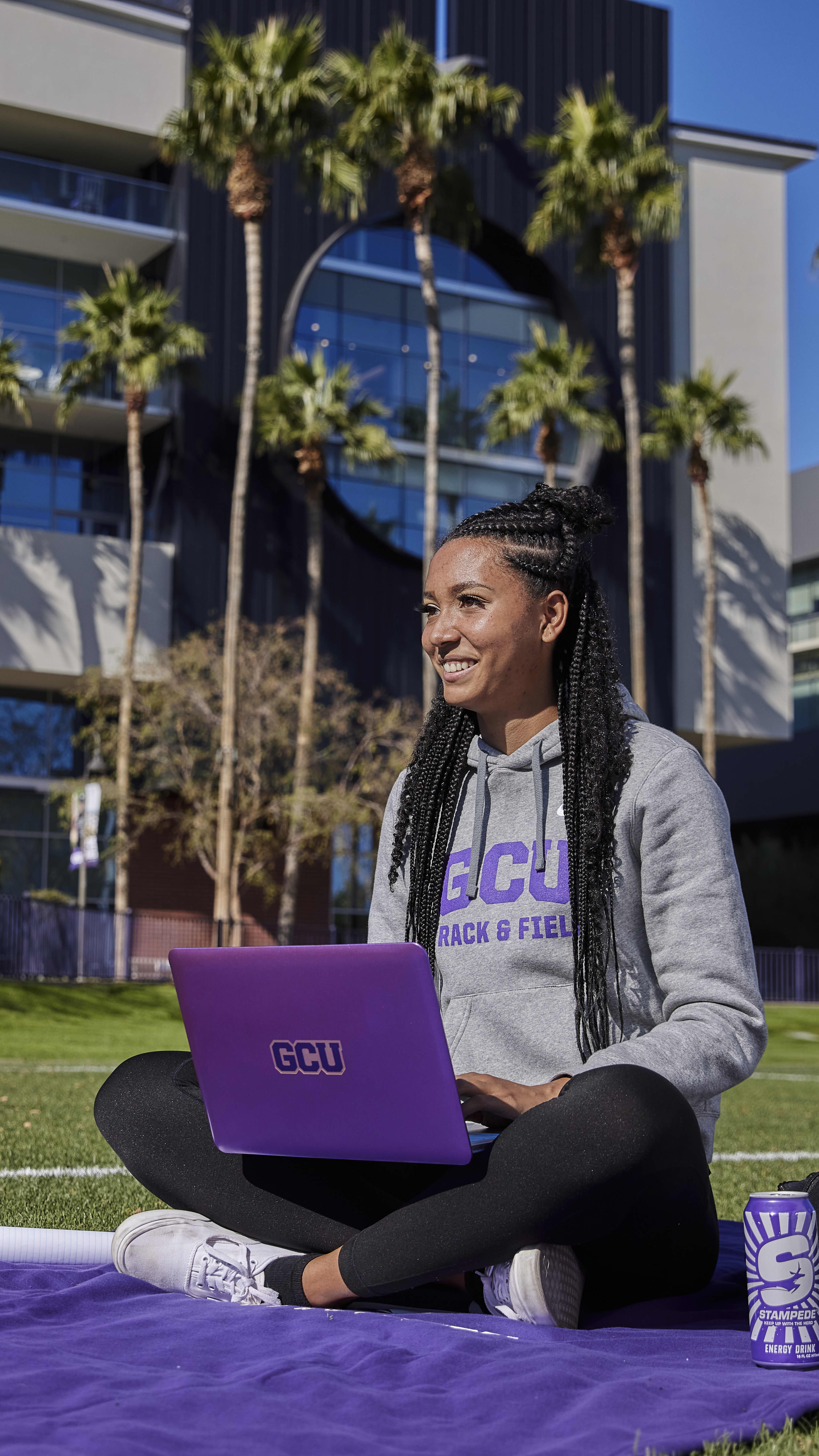 Female GCU student completing online degree coursework outside in FL