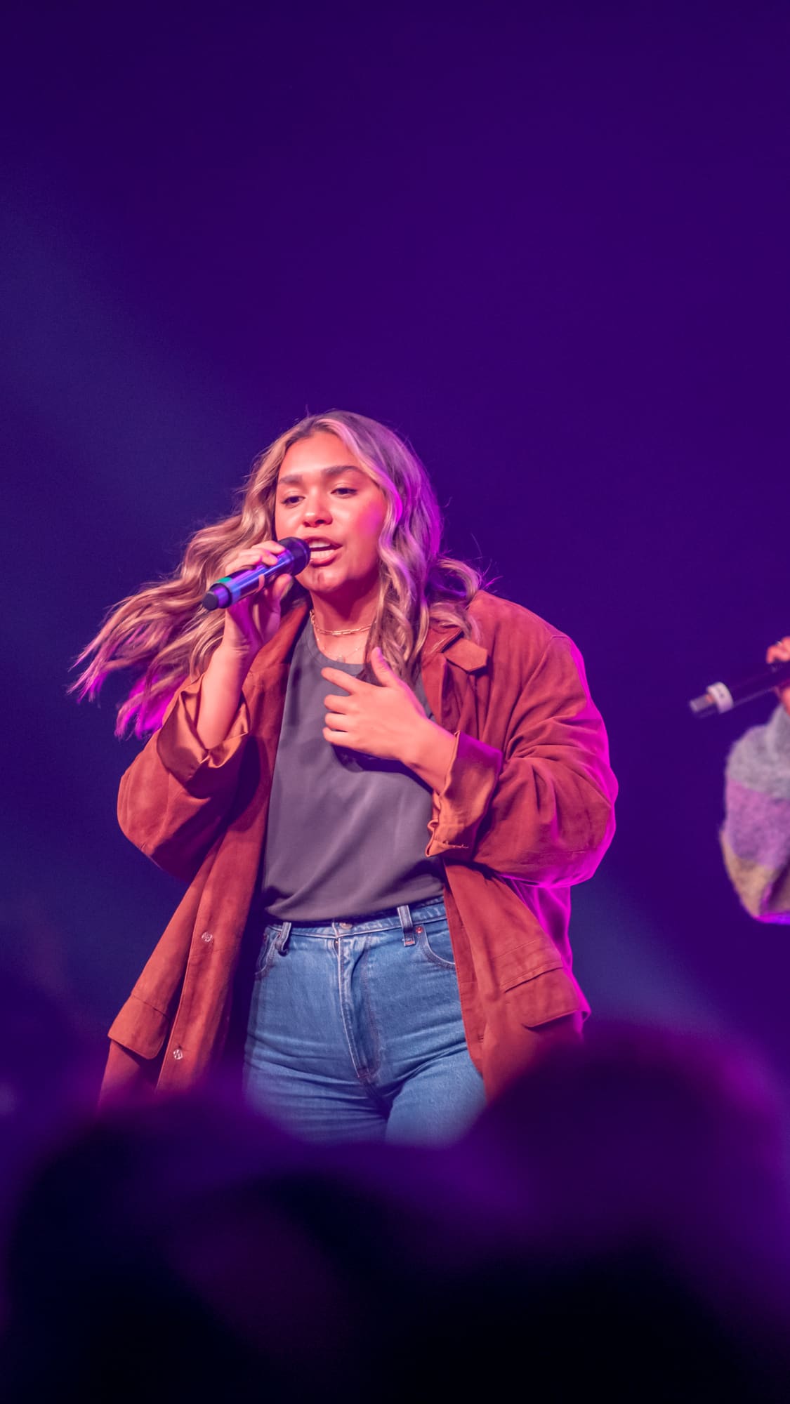 students singing at a weekly Chapel service