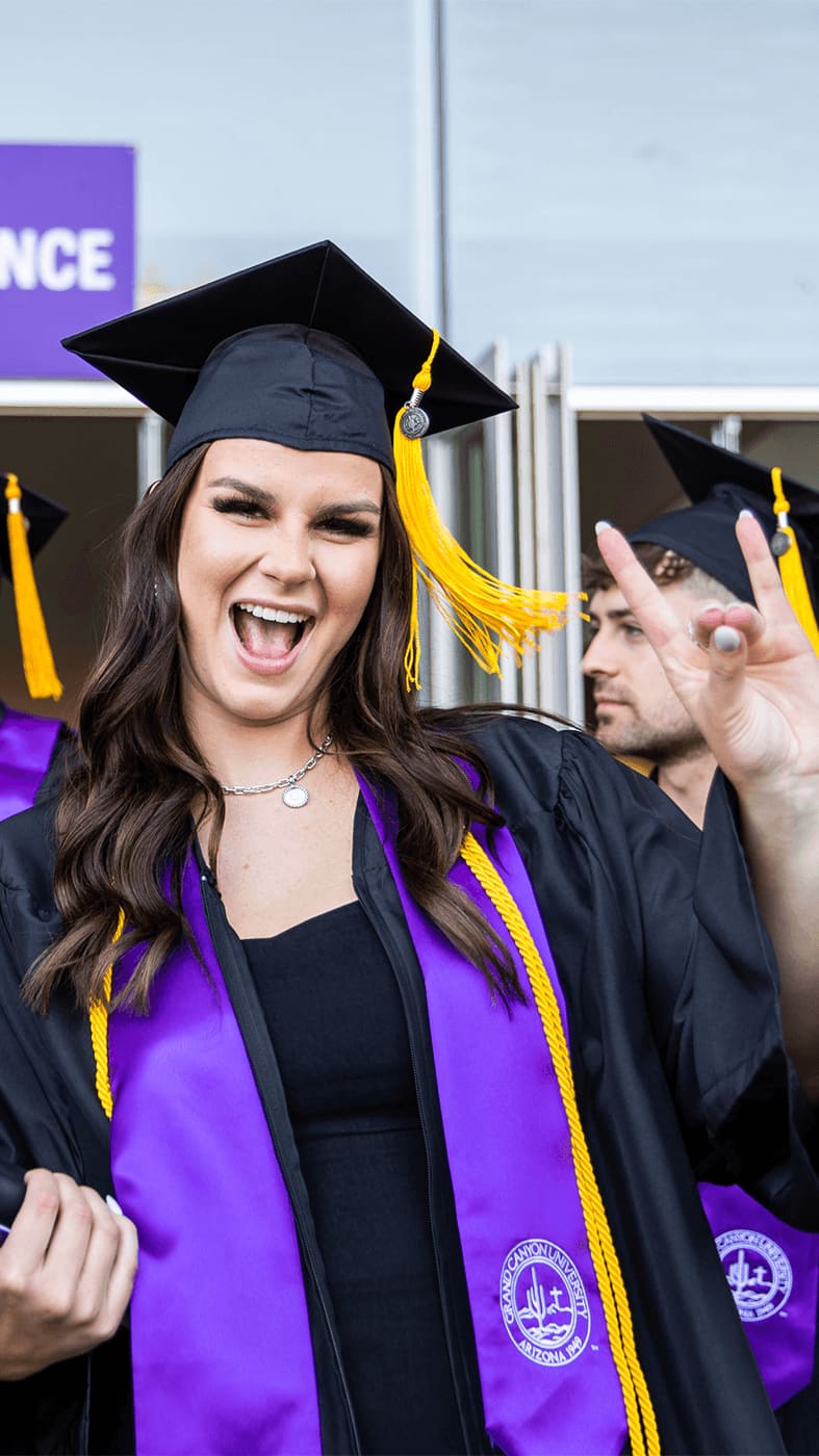 Girl holding Lopes Up at commencement