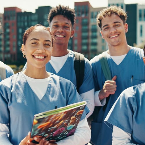 nursing students smiling at the camera