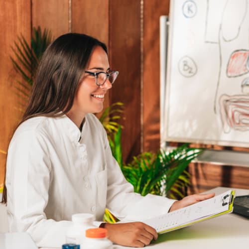 nutritionist working with client in her office