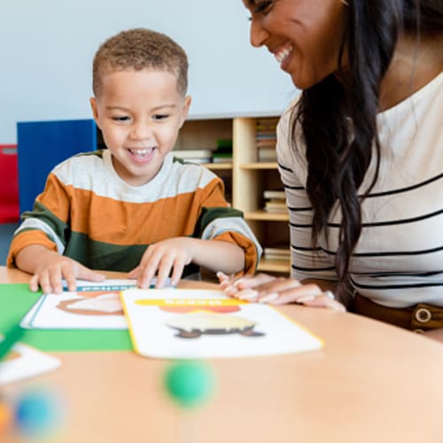 A developmental psychologist talking to a little boy