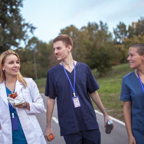 three nurses taking a walk together on a lunch break