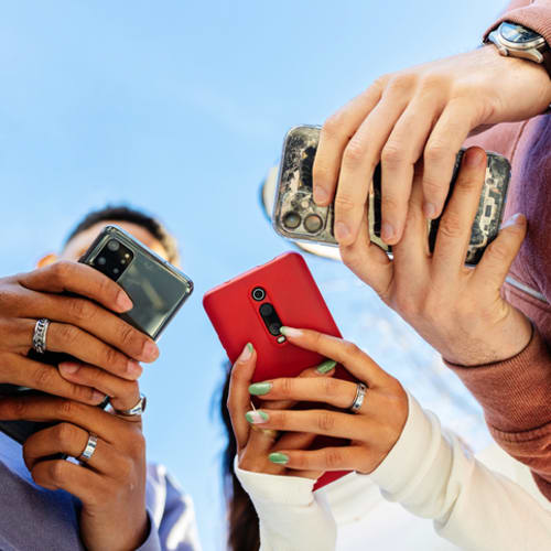 Teenagers interacting with phones