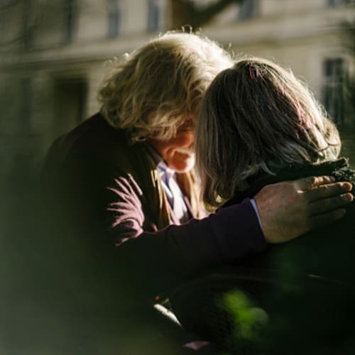 women praying for each other