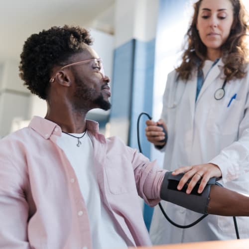 Portrait of a man receiving medical care while smiling - stock photo