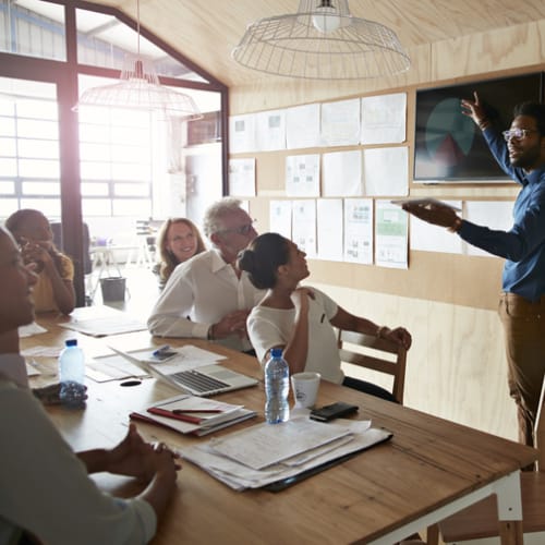 A group of people in a business meeting