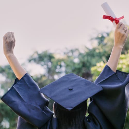 Graduation, education and success with a woman student holding a diploma or certificate in celebration outdoor. University, graduate and study with a female pupil cheering a college achievement - stock photo