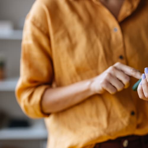 a woman using her phone indoors