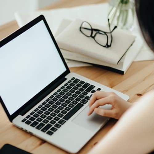 A woman writing an email at her computer