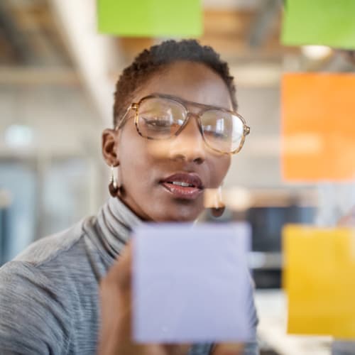 Creative director writing down notes about her ideas