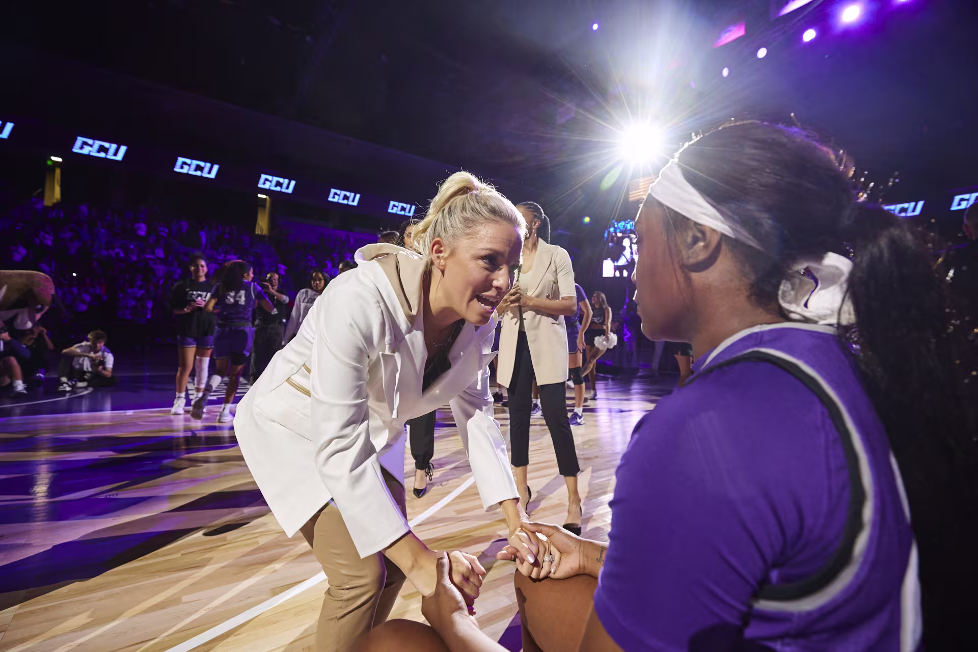 Human performance psychologist talking with basketball player