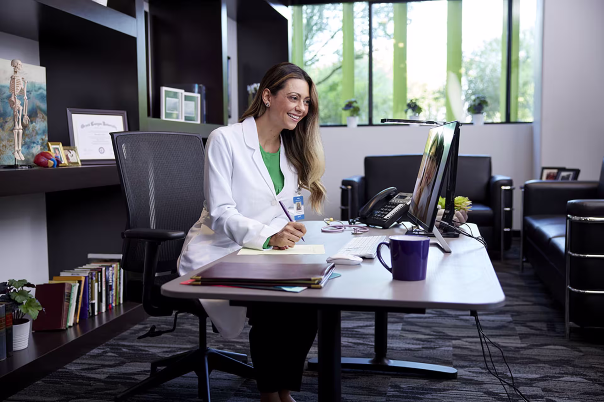 Female healthcare professional having telehealth call in office