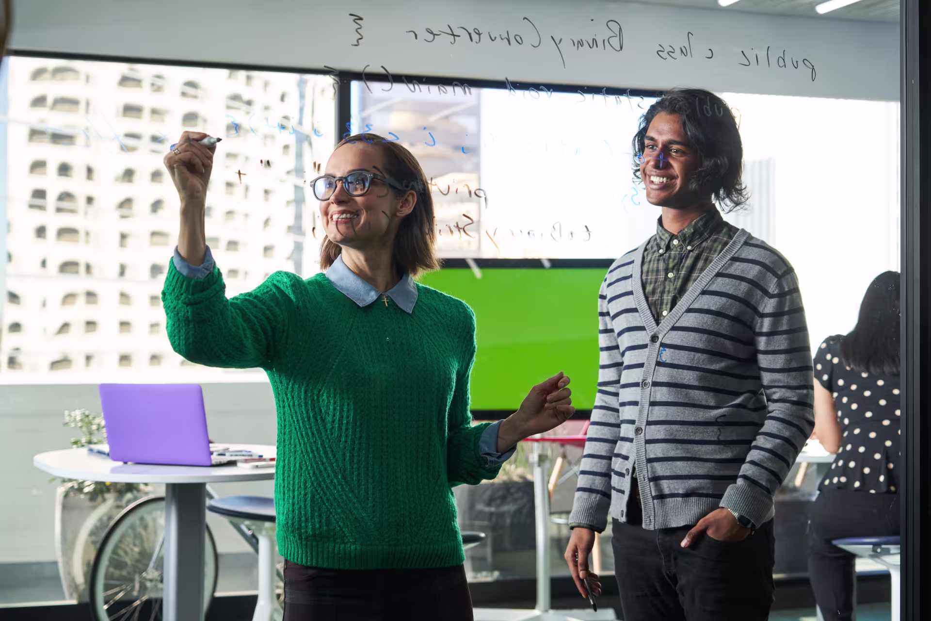 graduate-students-writing-on-conference-board