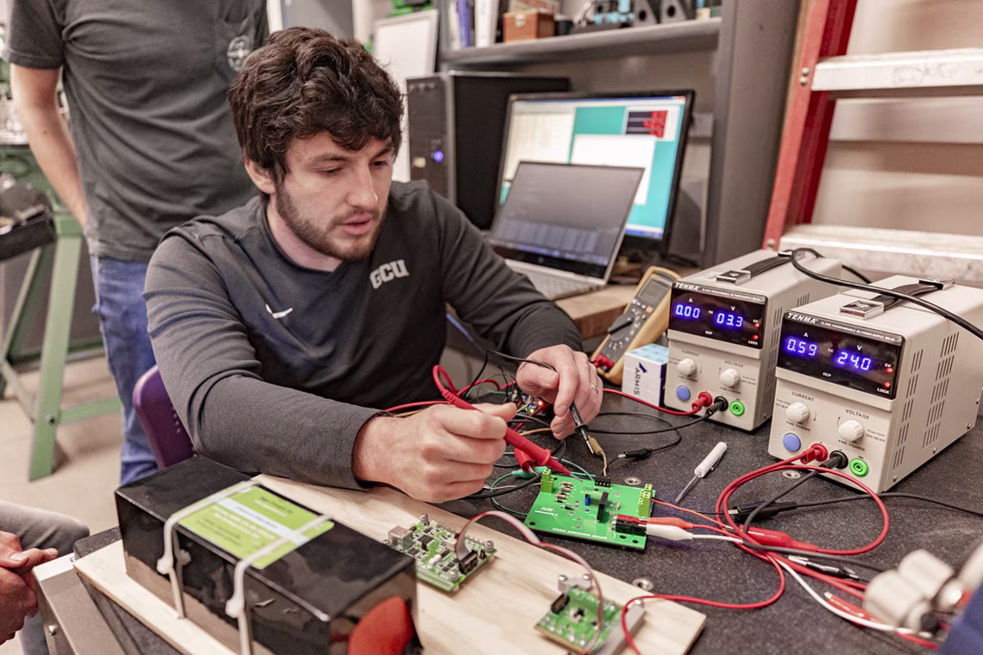 Male BS Applied Technology student working on projects