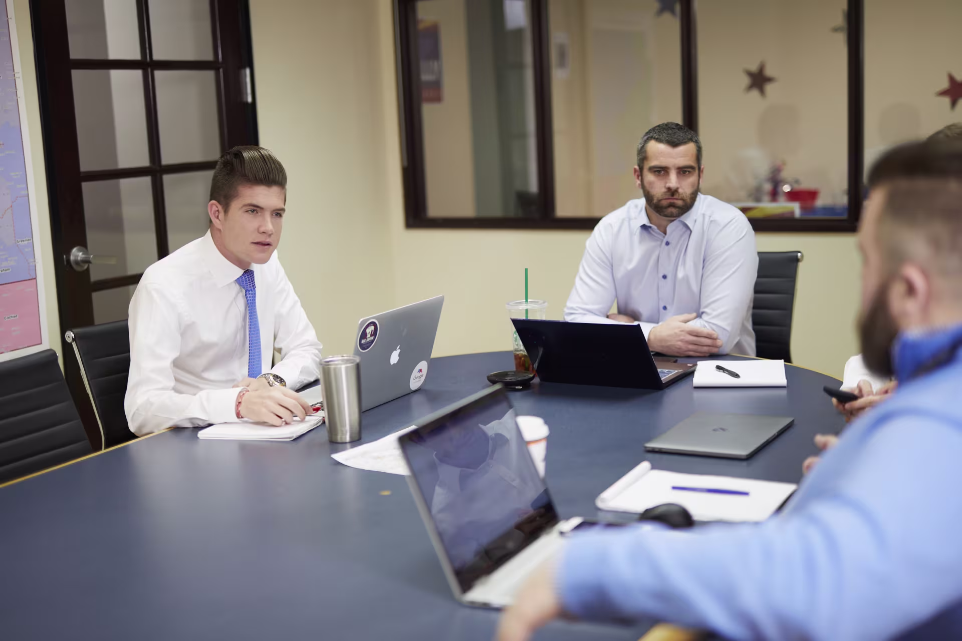 Male criminal justice legal studies students discussing points at a panel