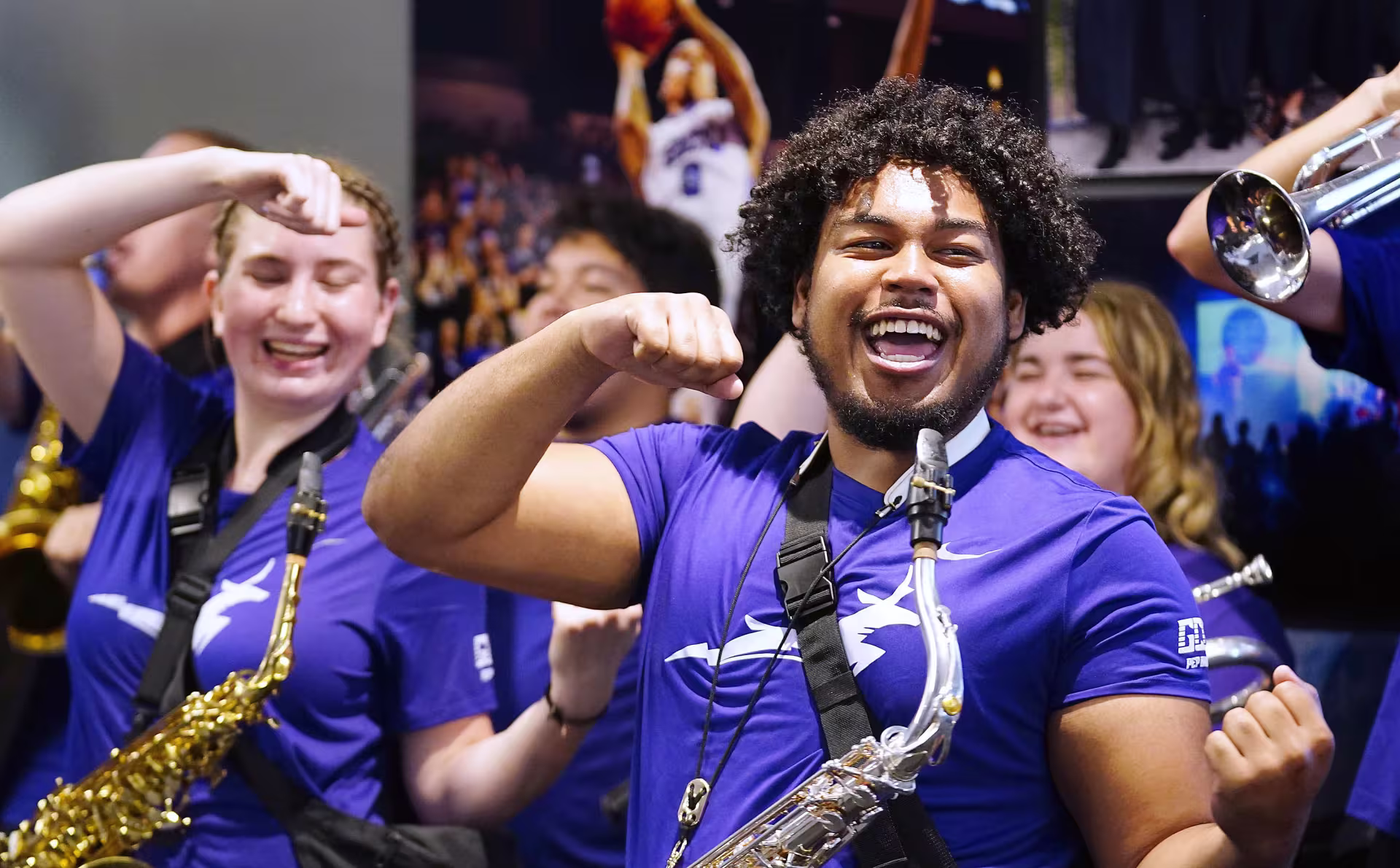 Male and female saxophonists performing