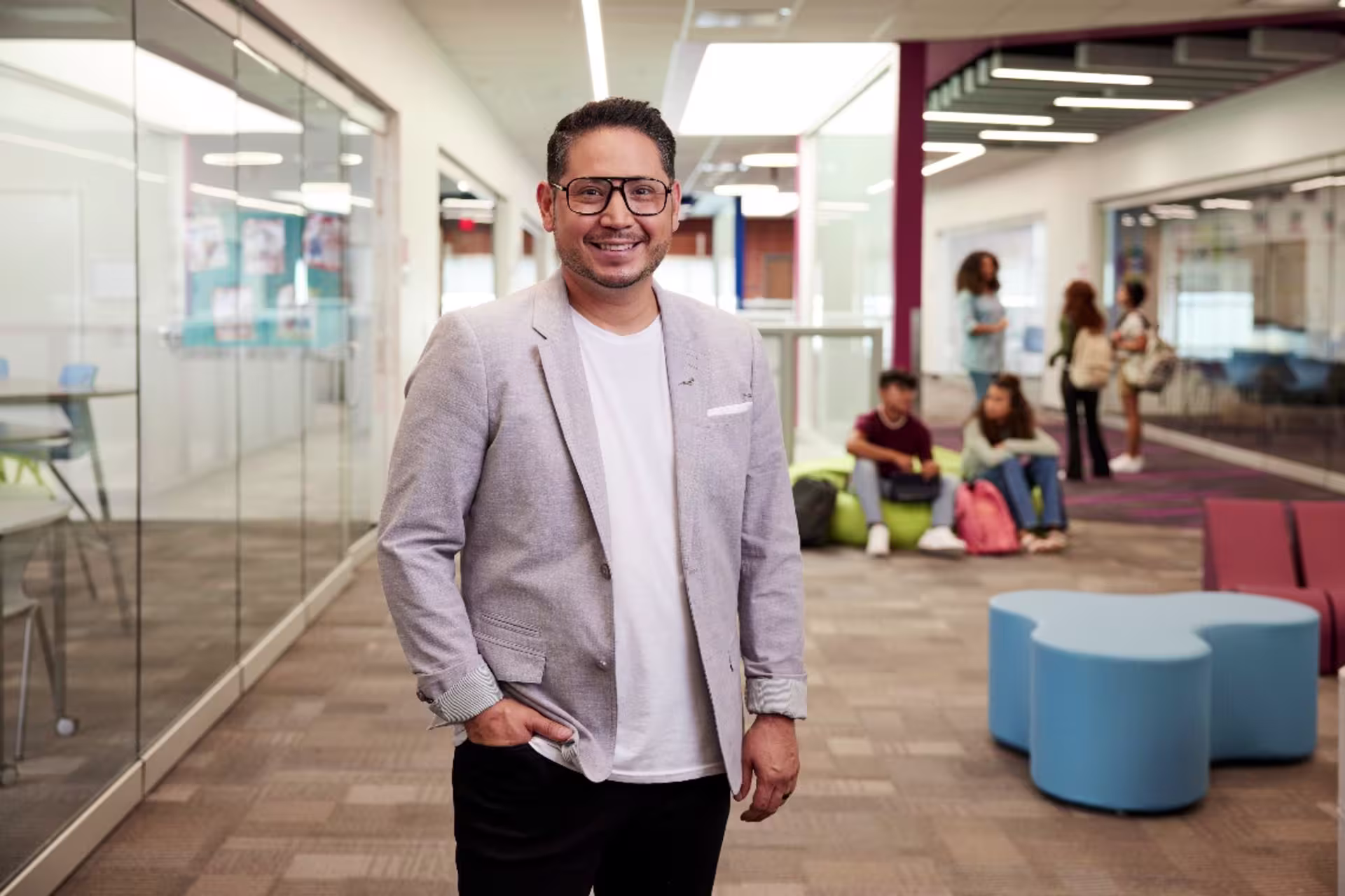 Man in education leadership standing in school