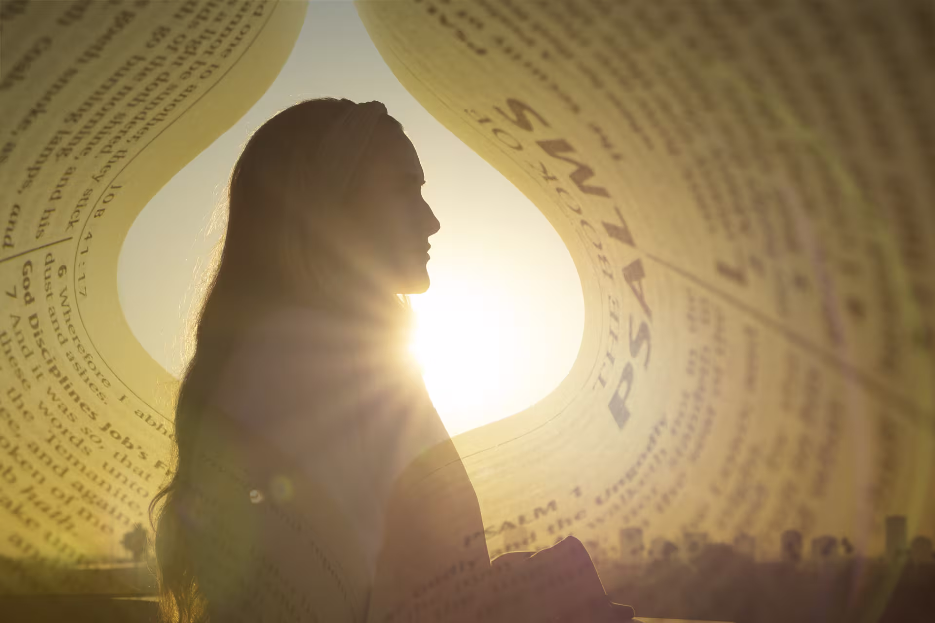 Overlapping image of Bible pages and woman outdoors in sun