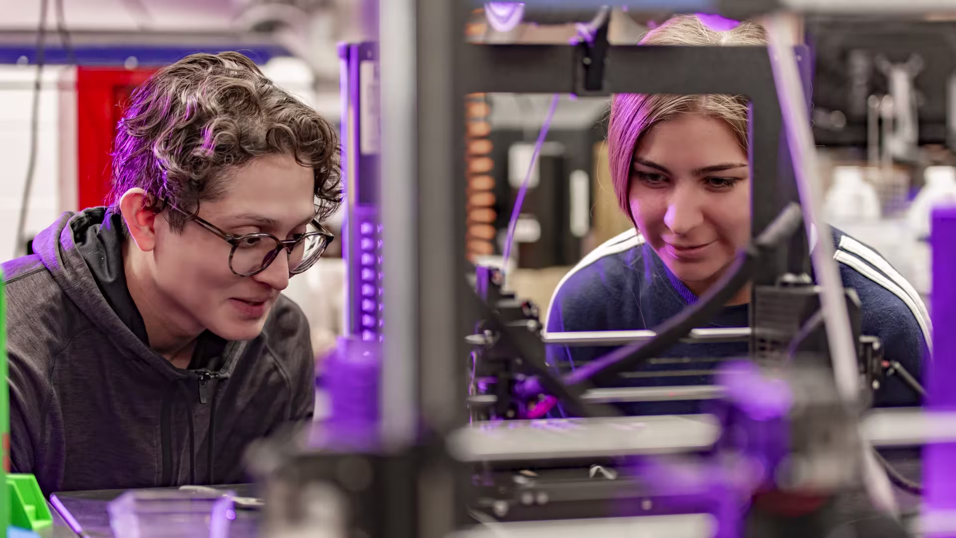 Two engineering students working on a capstone project in the lab