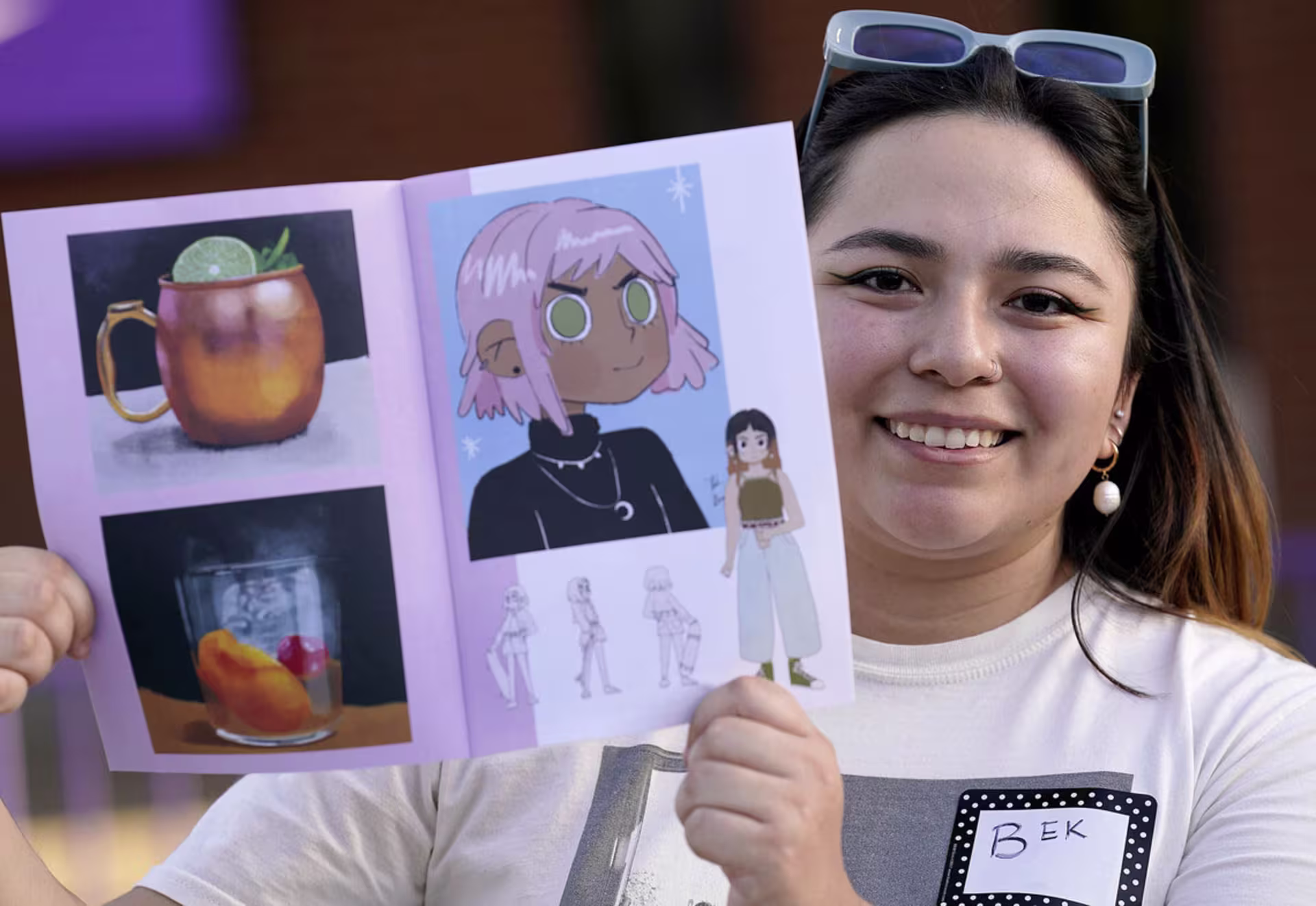Female animation student showcasing work at design showcase