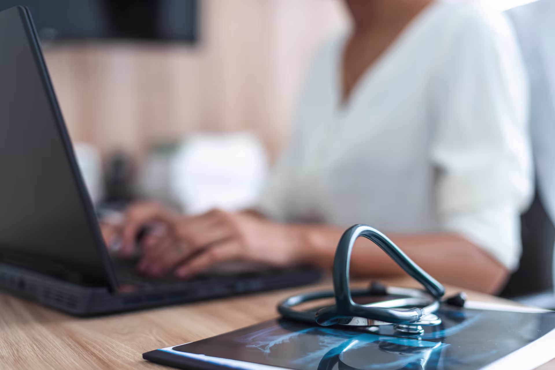 woman mental health and wellness worker using laptop to study for integrated health emphasis certificate