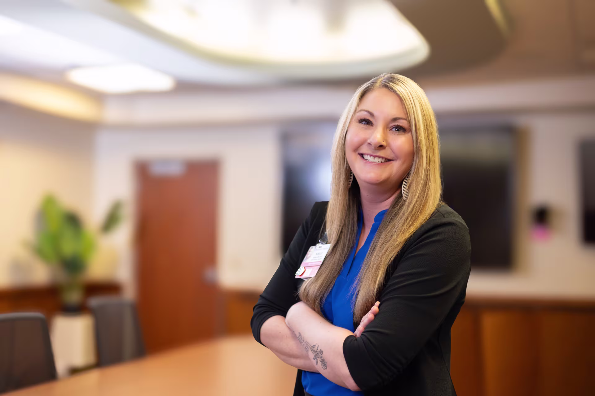 woman-healthcare-worker-smiling-and-crossing-arm