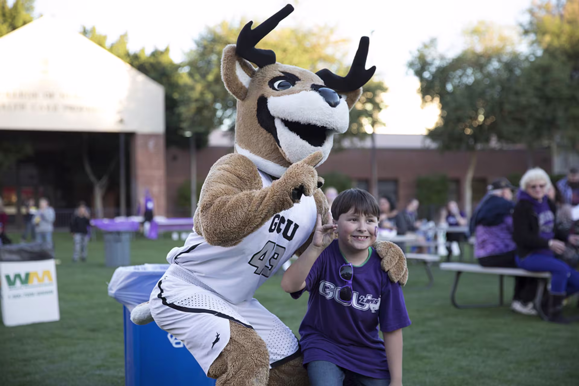 Young male posing and smiling for photo with Thunder