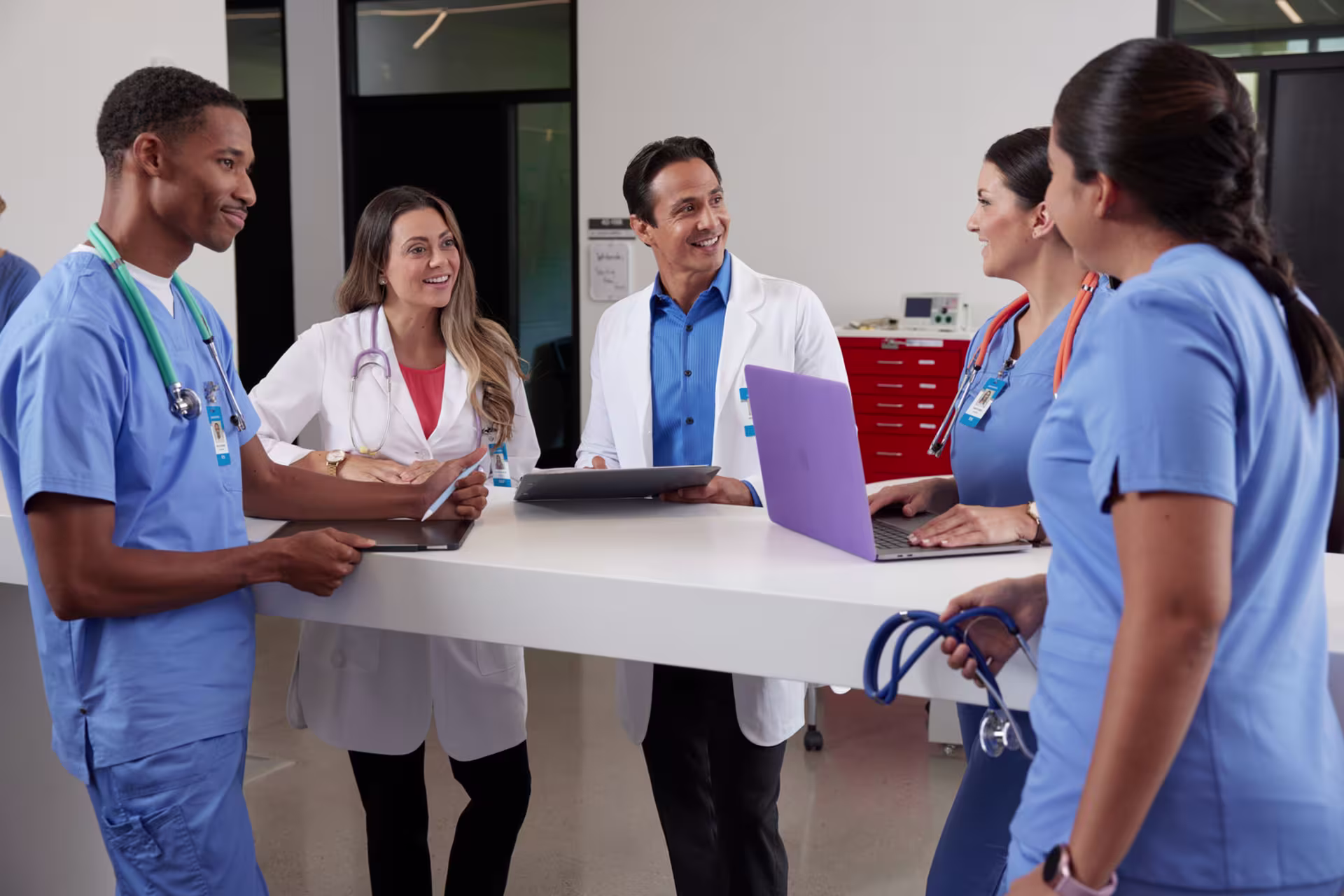 dnp nurses and staff around table for nursing education