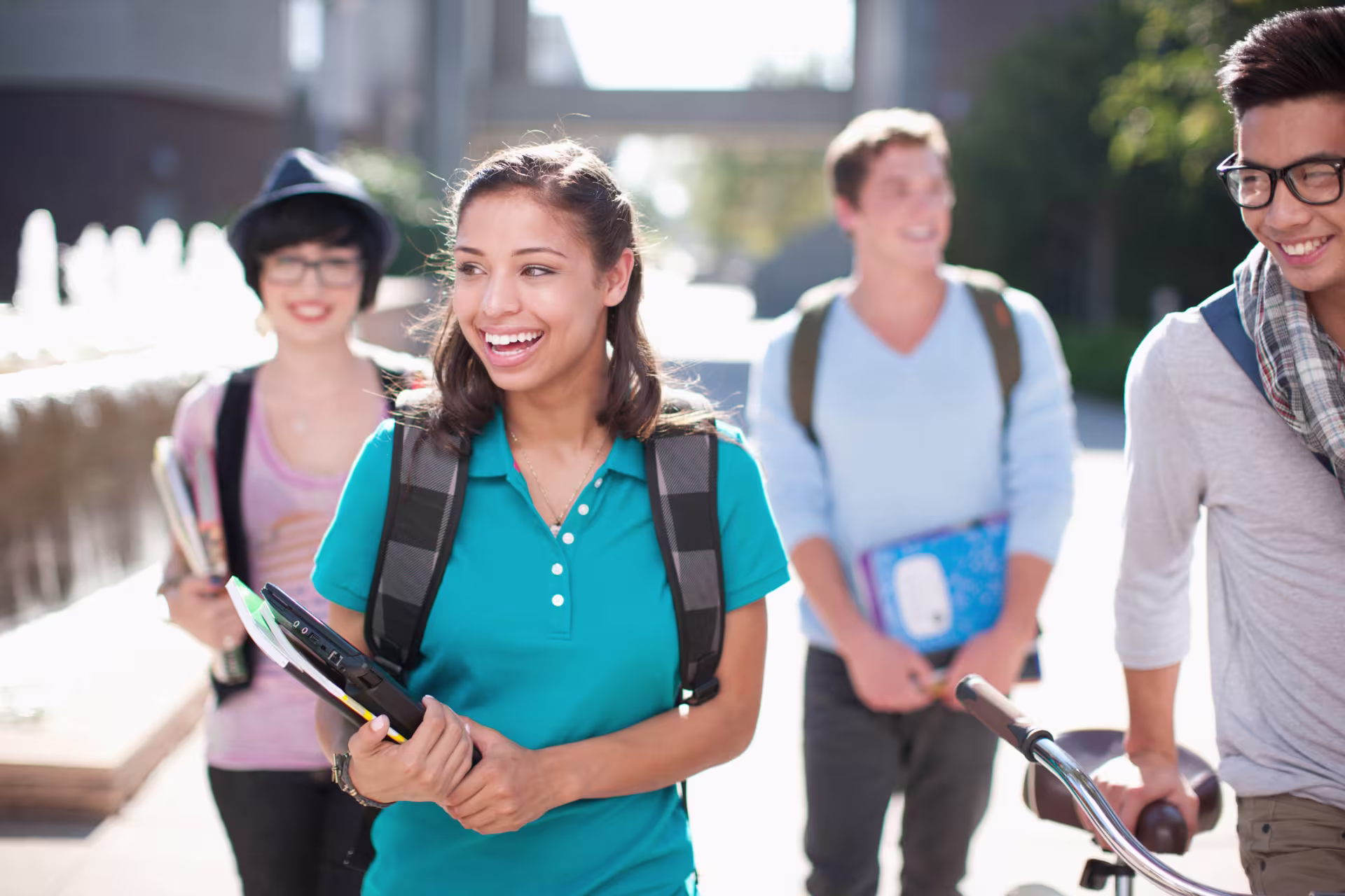 students walking outside after class laughing together