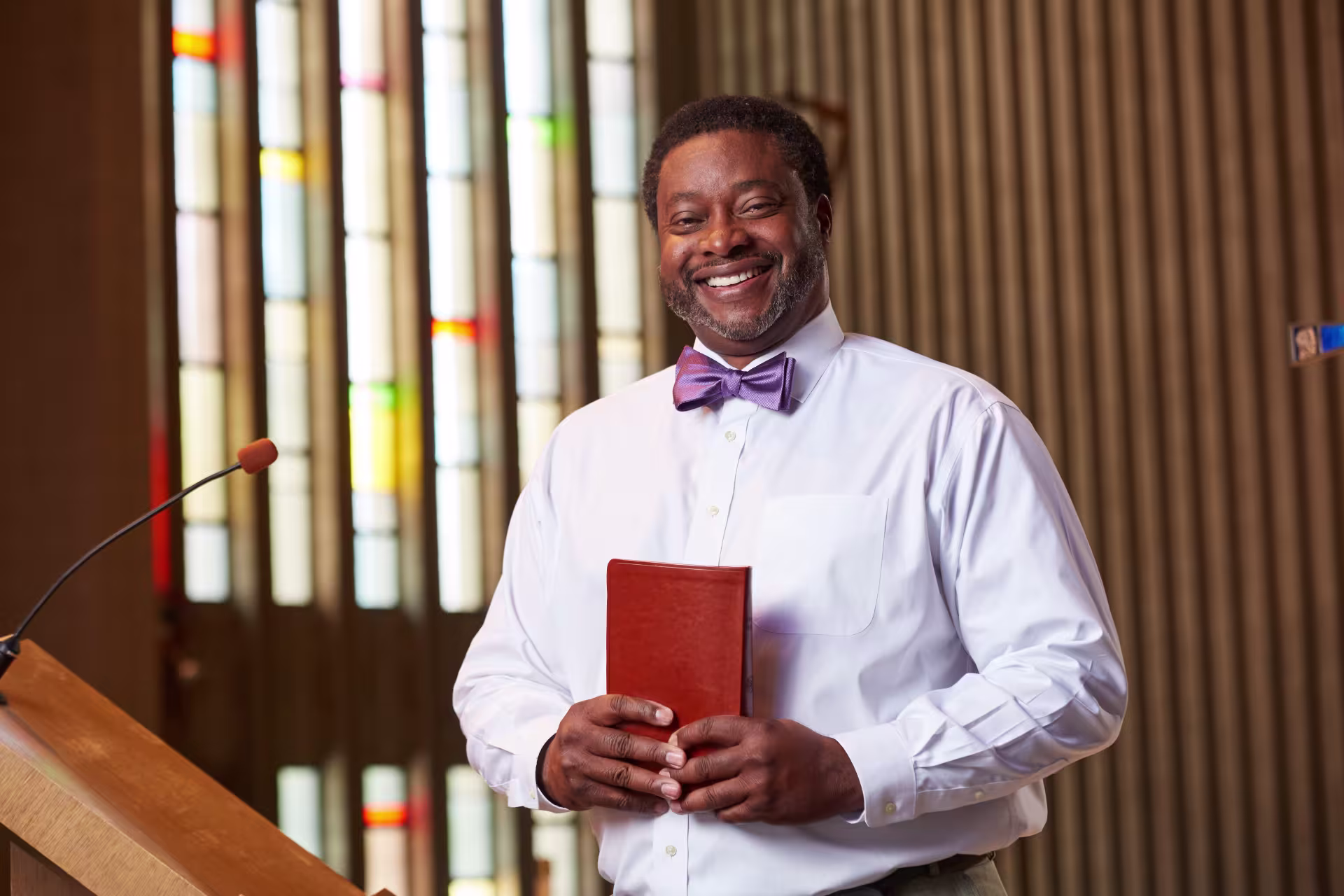 Christian ministry pastor standing in church