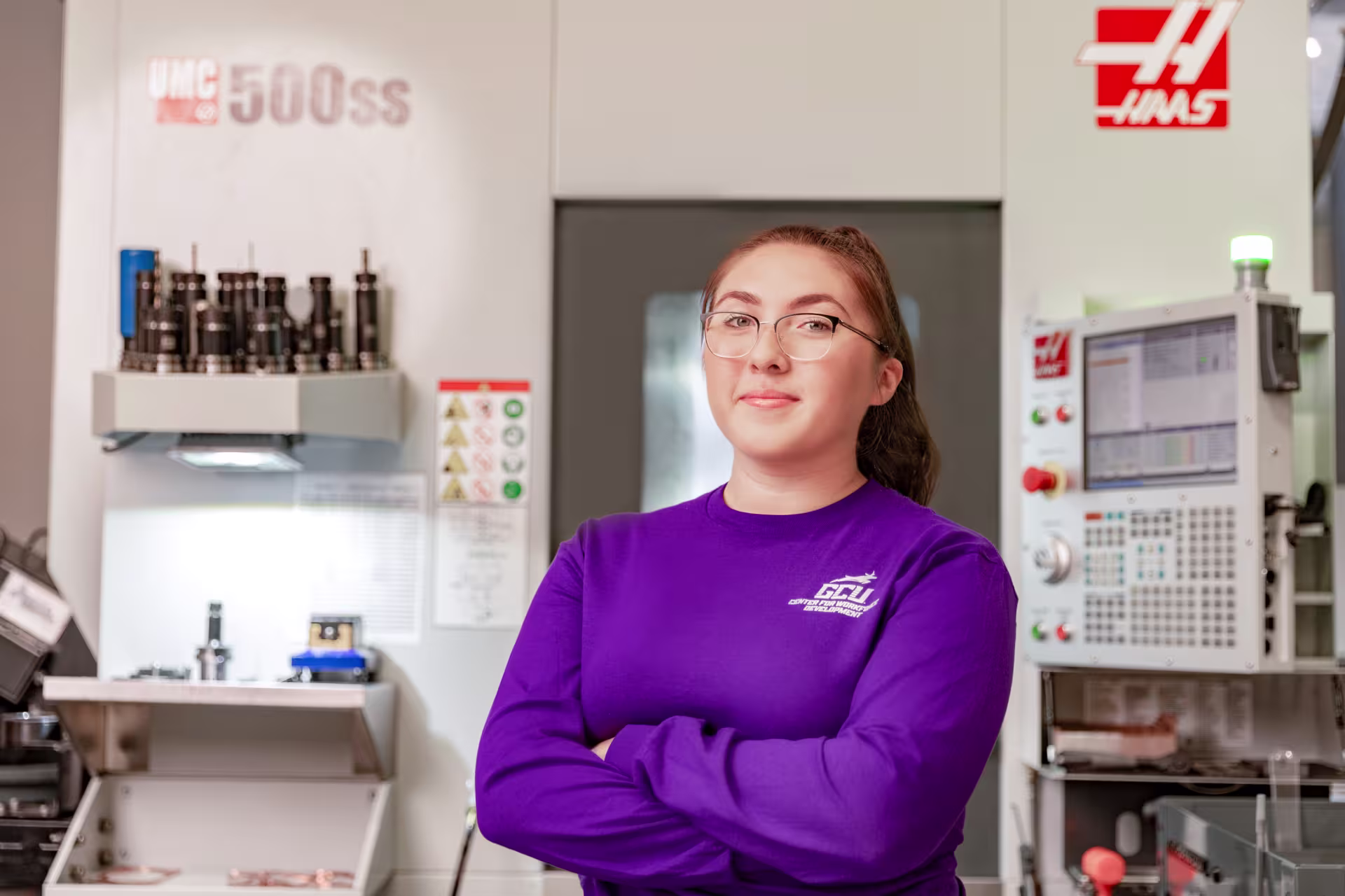 Female CNC machinist posing