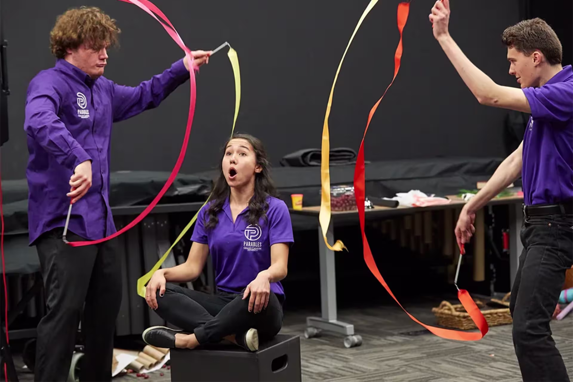 Male and female GCU Parables members demonstrating exercise