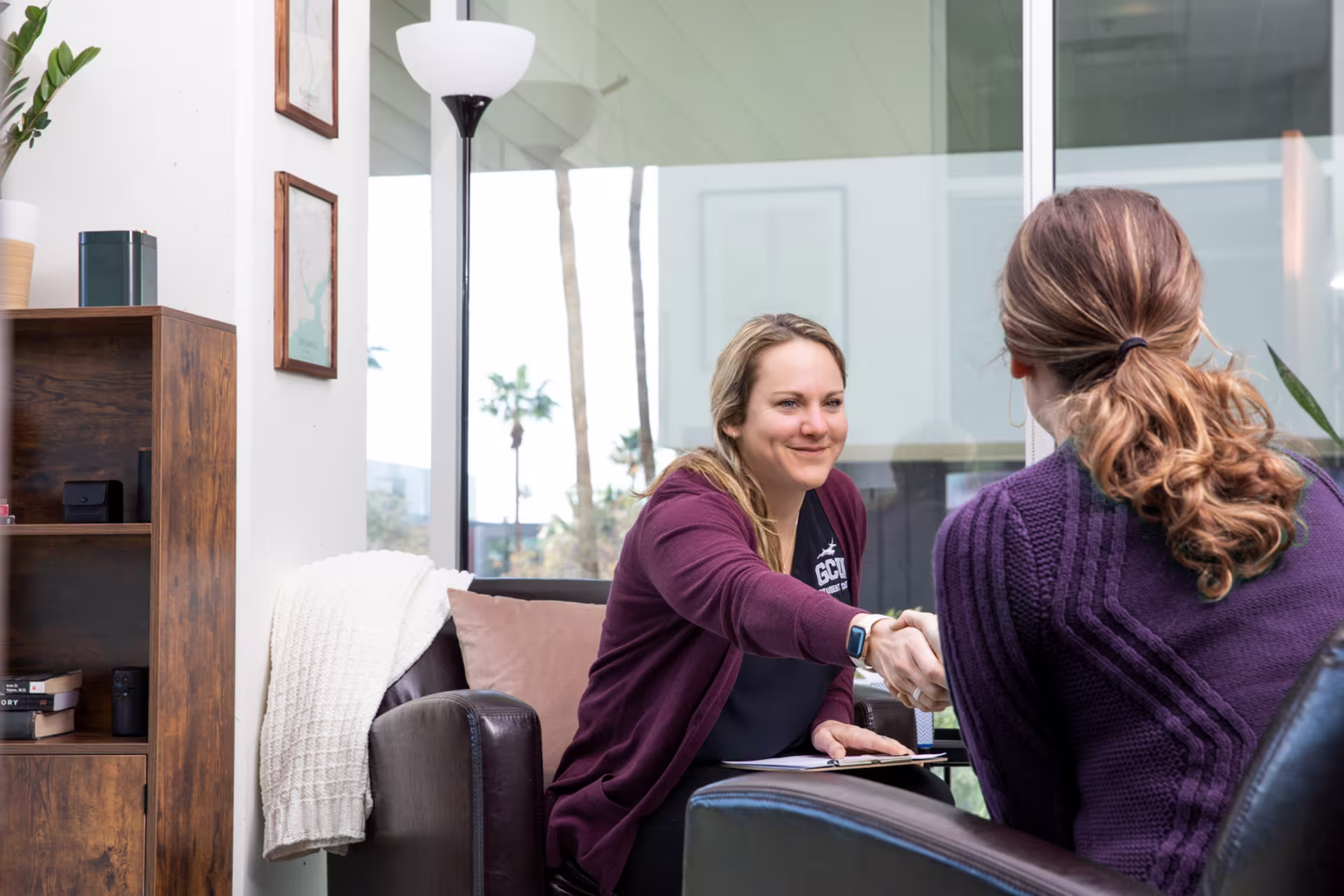 GCU student care representative working with a student on a variety of services