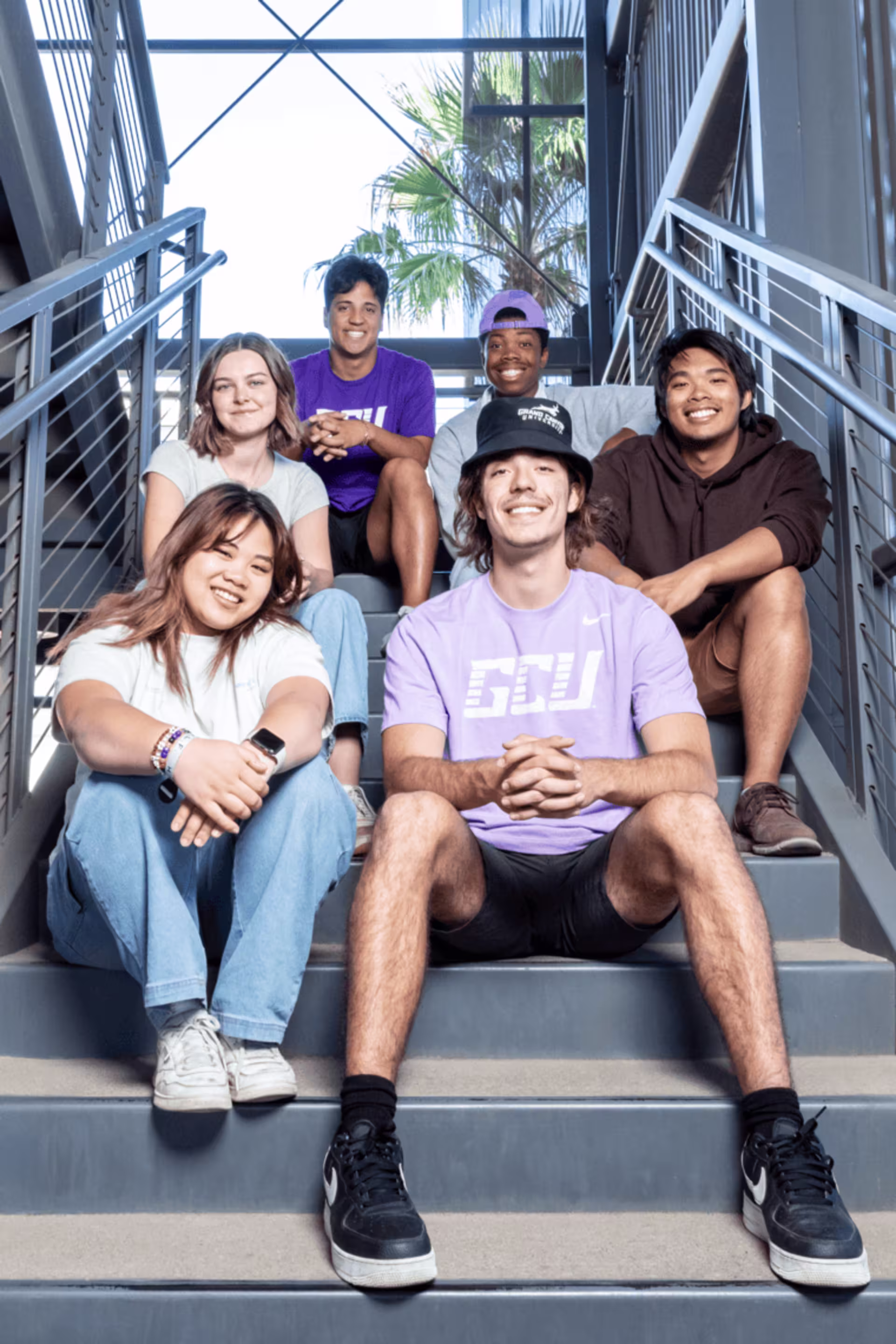gcu students sitting on stairs.