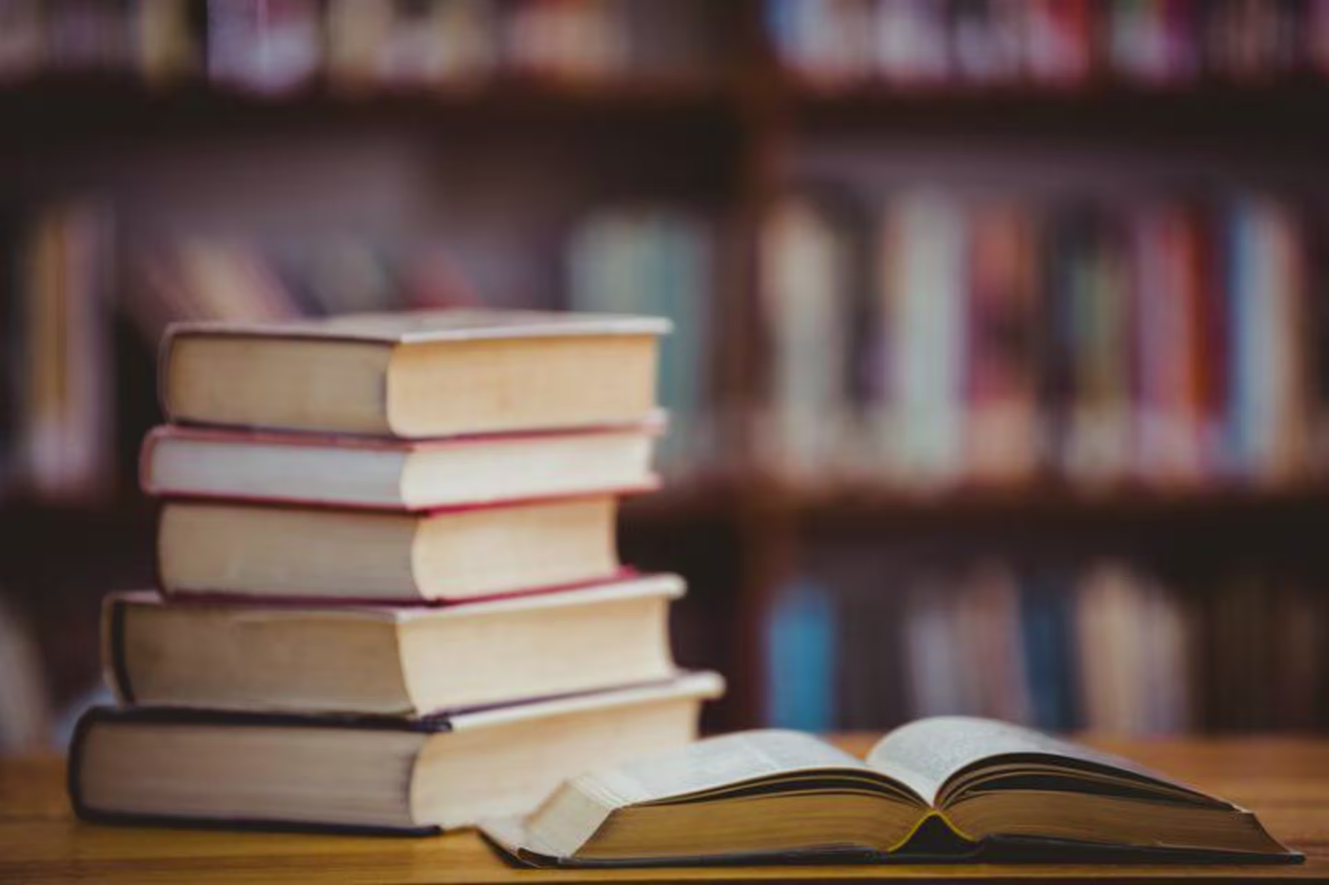 Stacked books in a library settting
