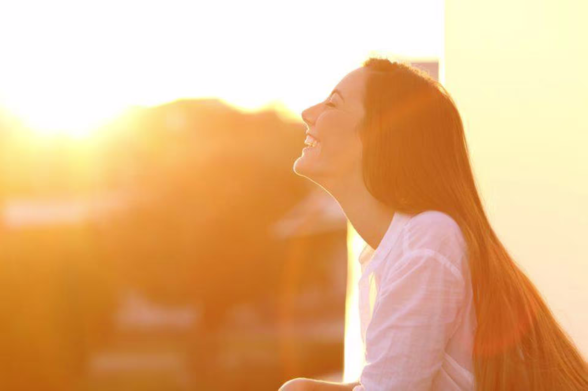woman smiling in sunlight