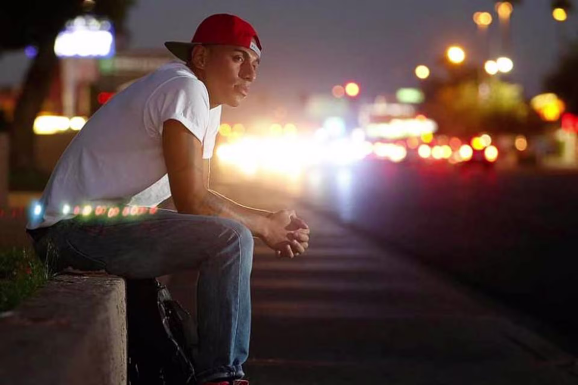 Young person reflecting by a street