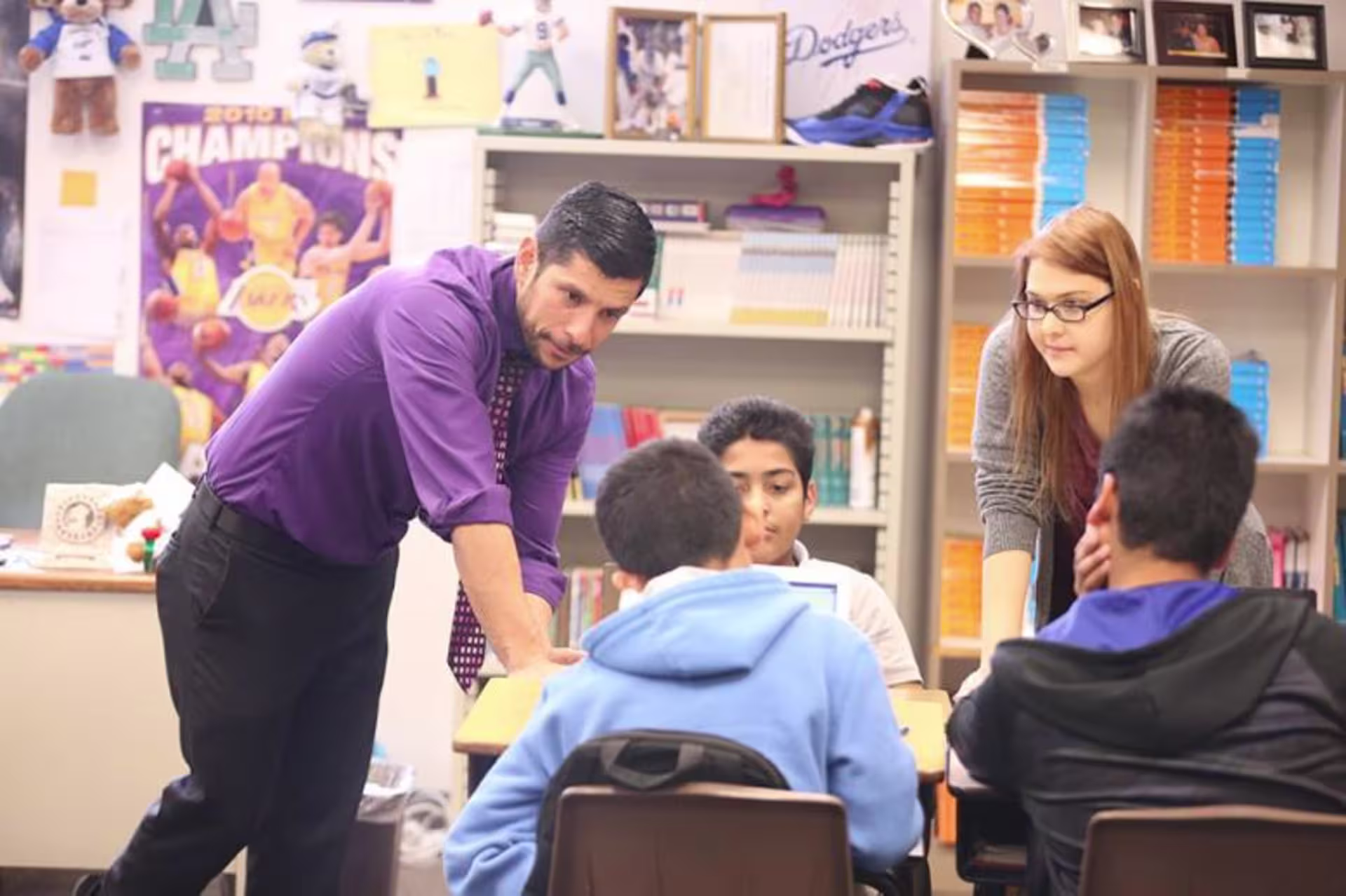 Teacher helping students in classroom