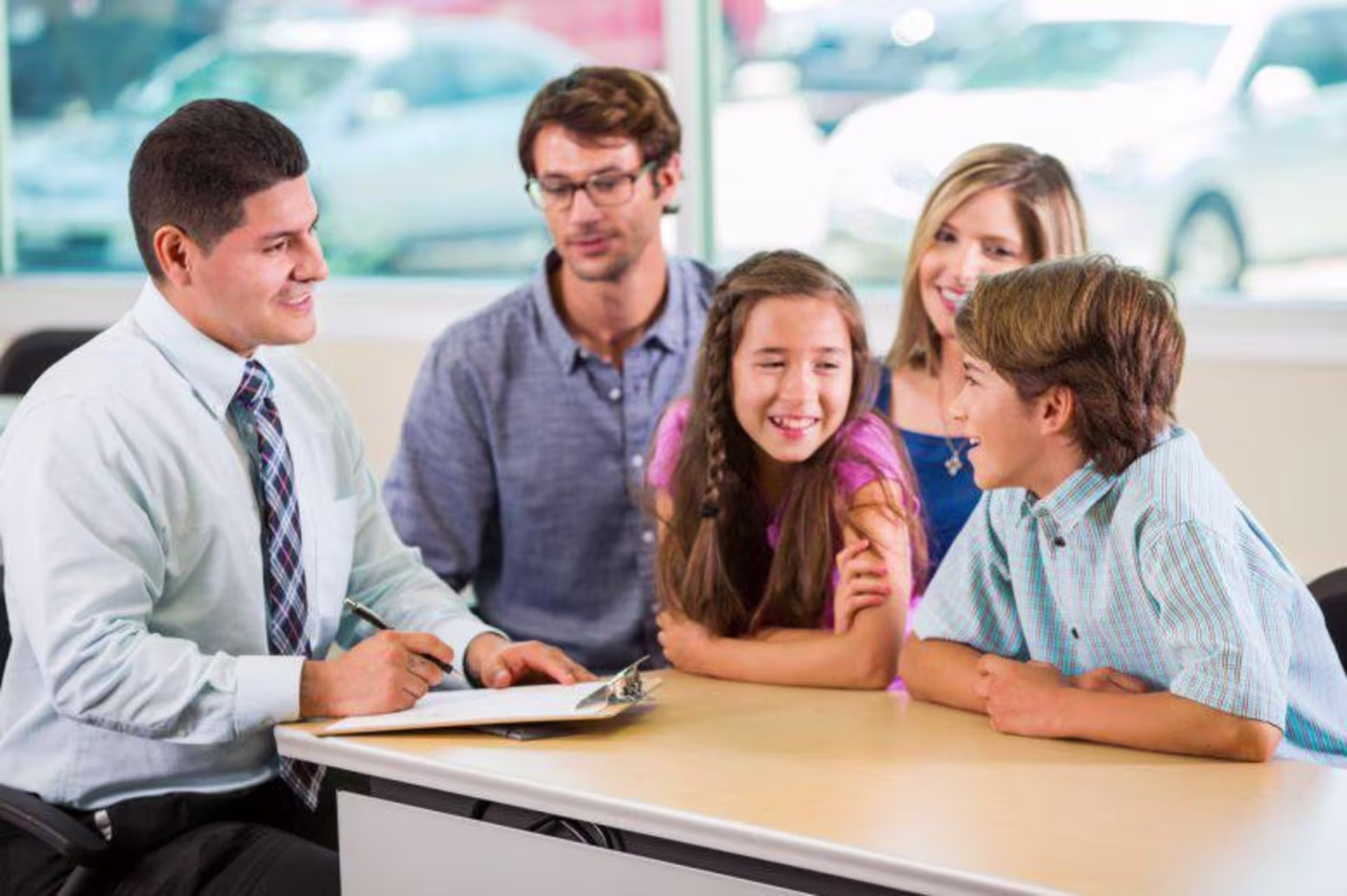 Family counselor asks kids questions with parents behind them