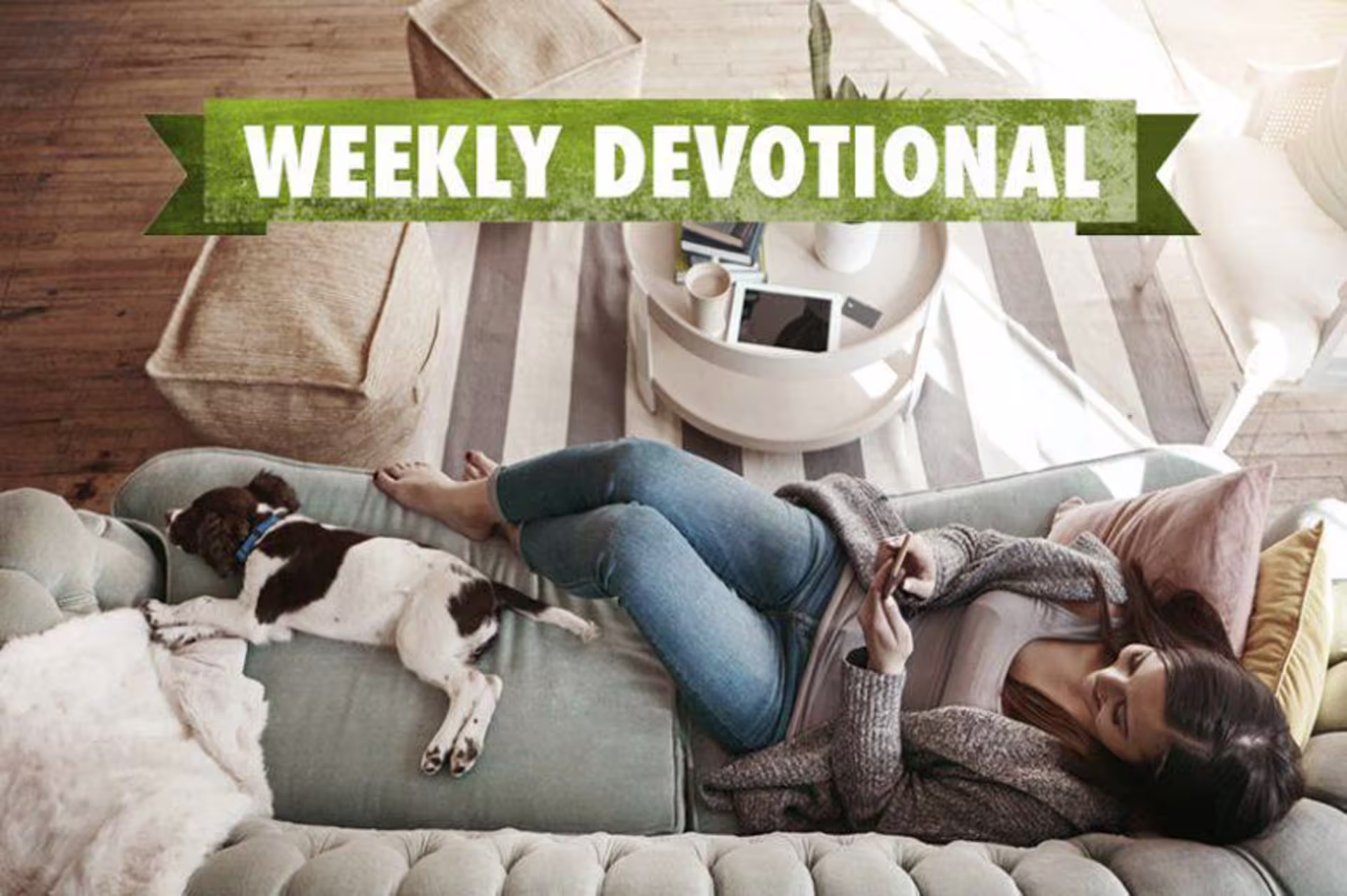 Girl sitting on couch with dog 