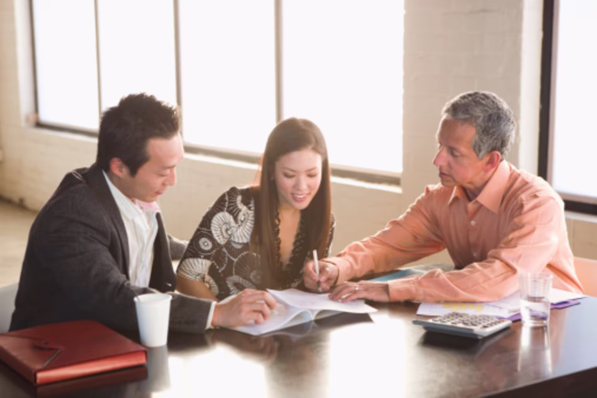 Case manager helping a couple with paperwork