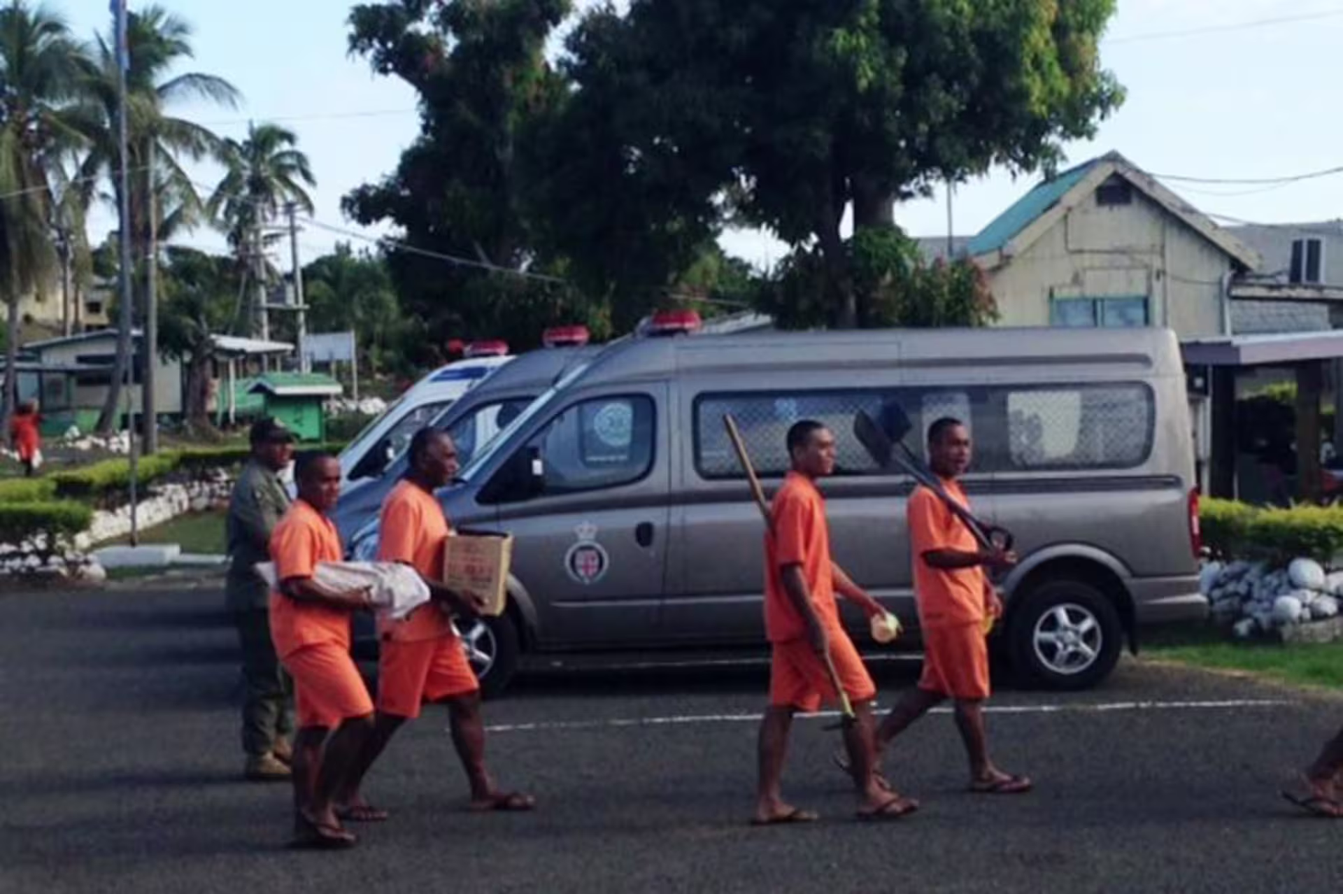 people wearing orange carrying different items