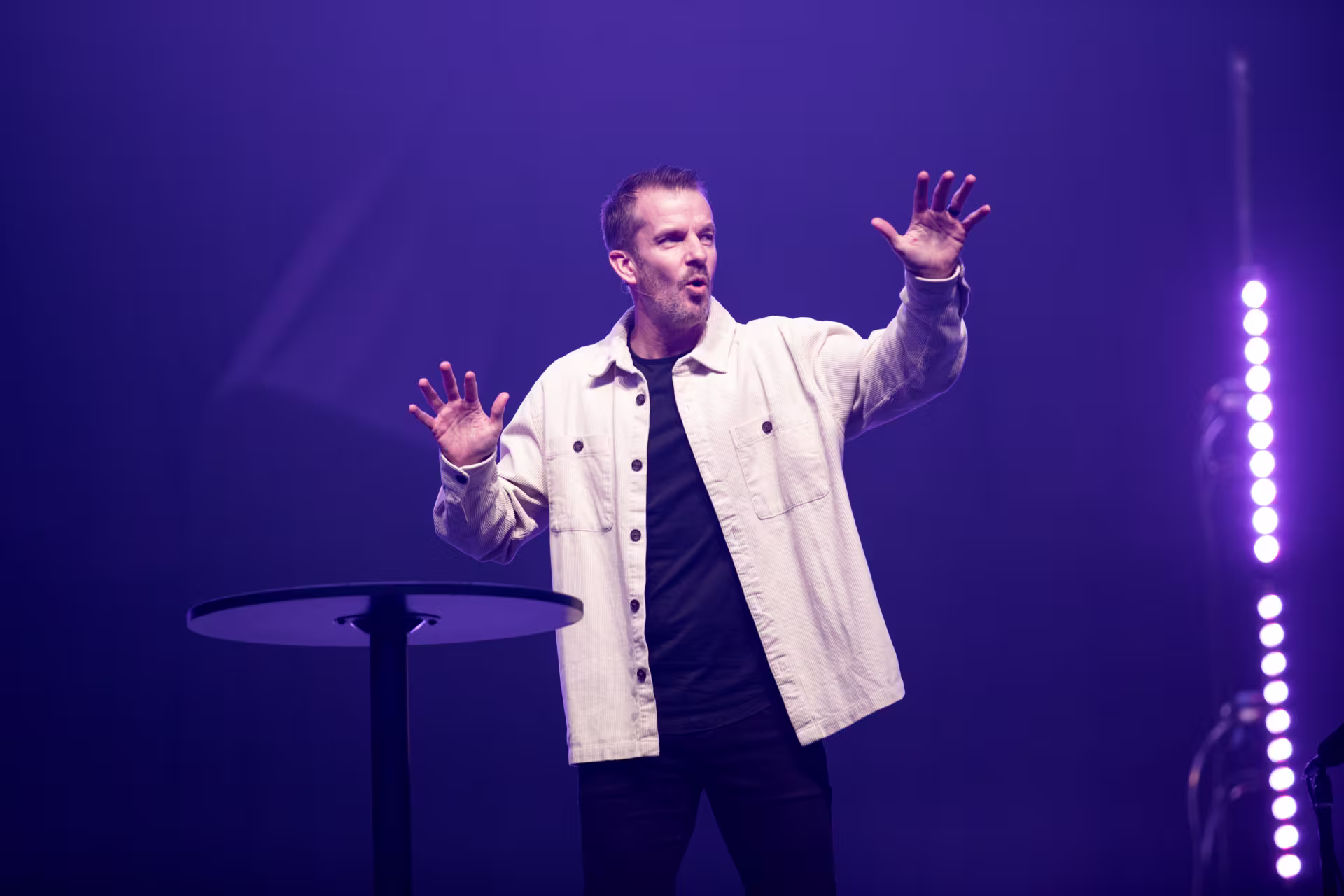 Pastor giving a sermon on stage