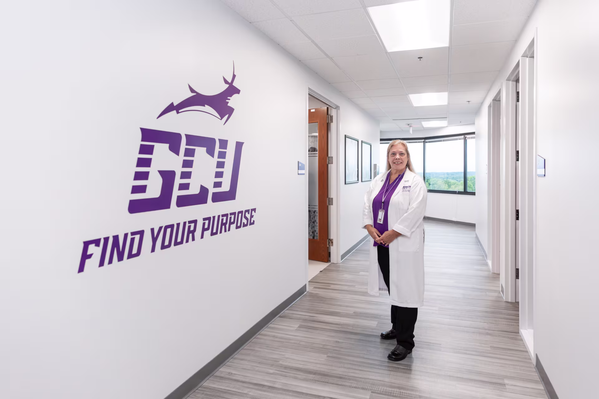 Female nursing educator standing in hallway of GCU nursing college