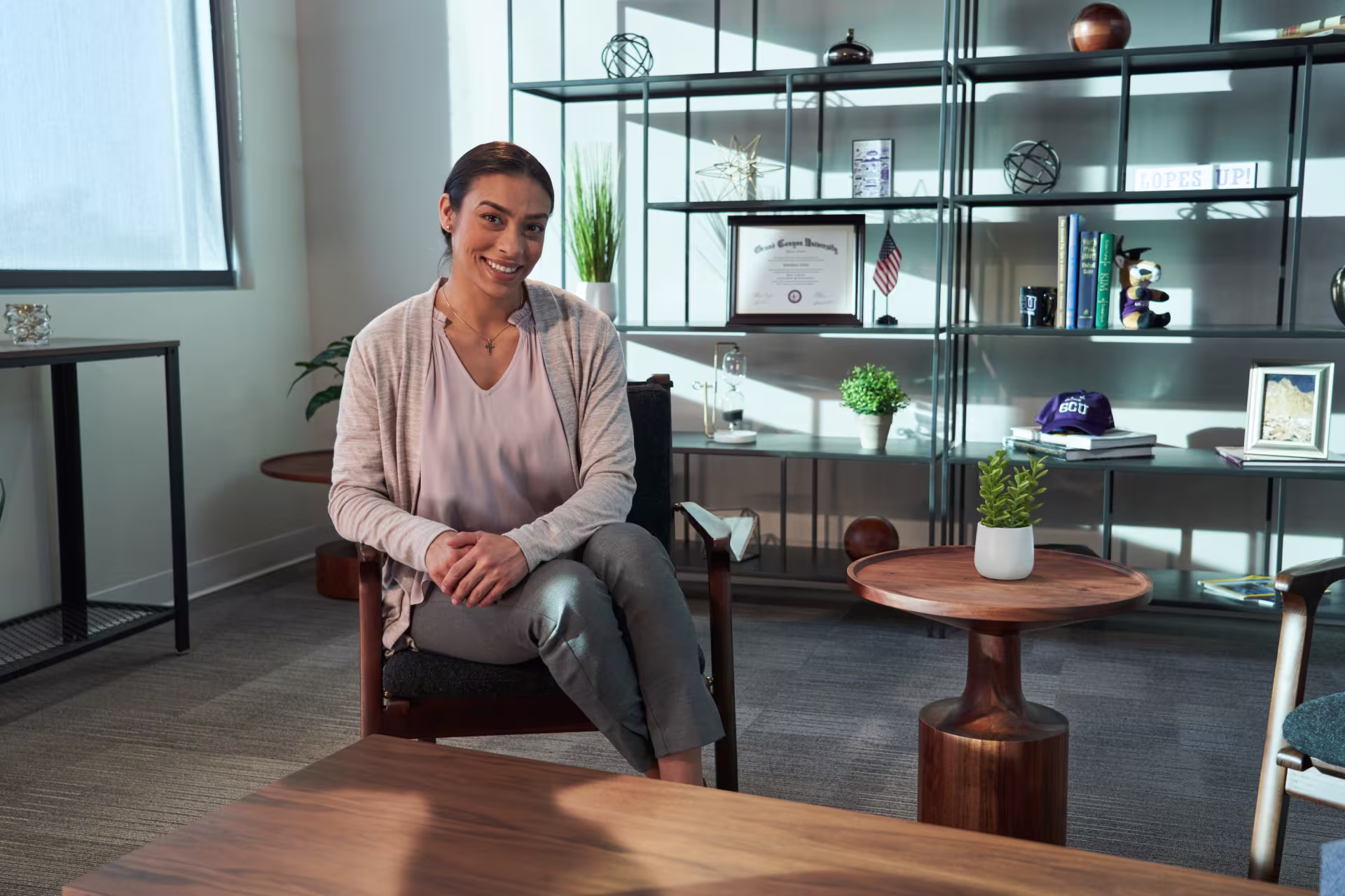 Female psychologist smiling while sitting in office