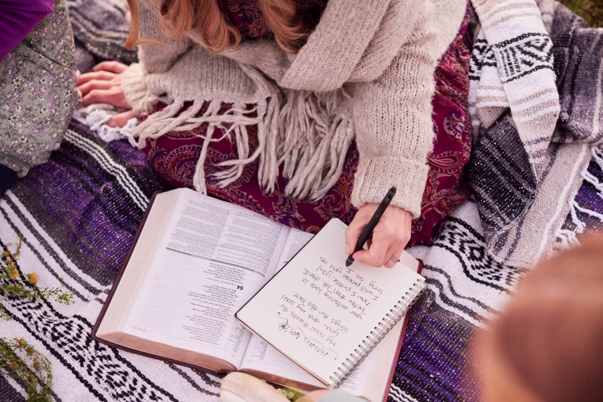 student writing bible notes.