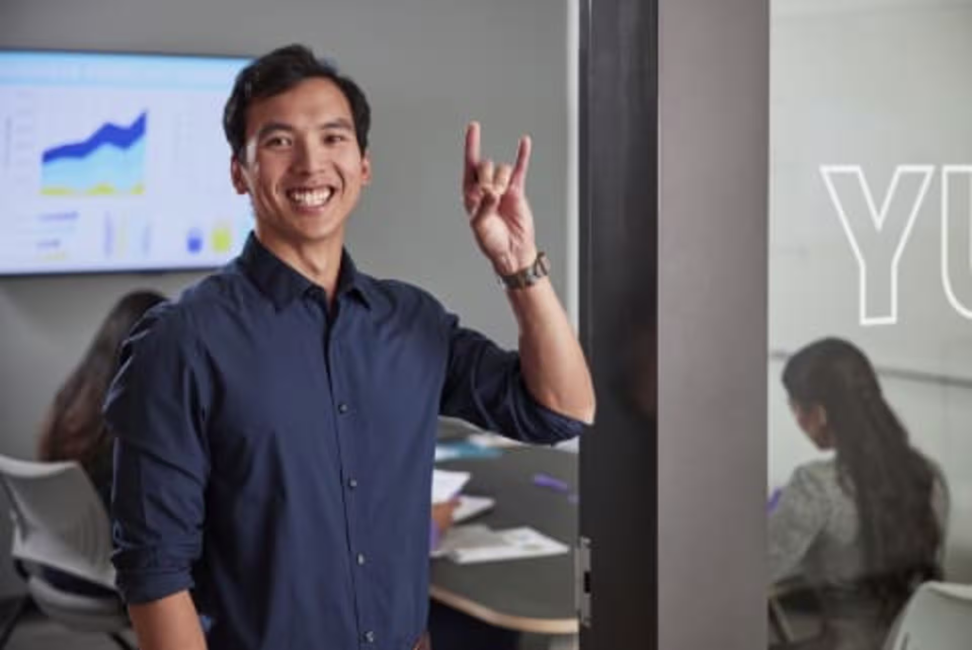 Business analytics student standing in front of group